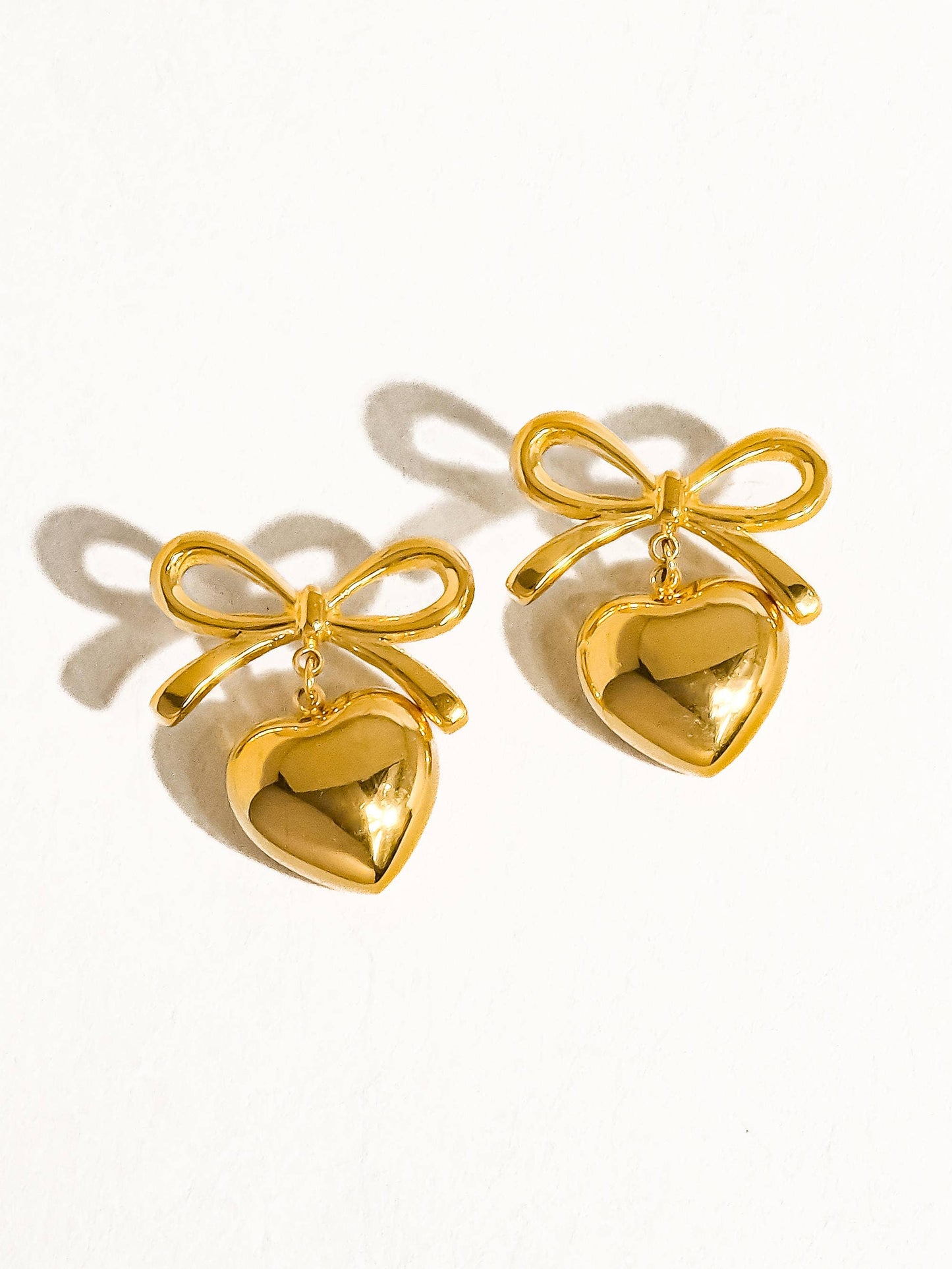 Melody Bow Heart Studs