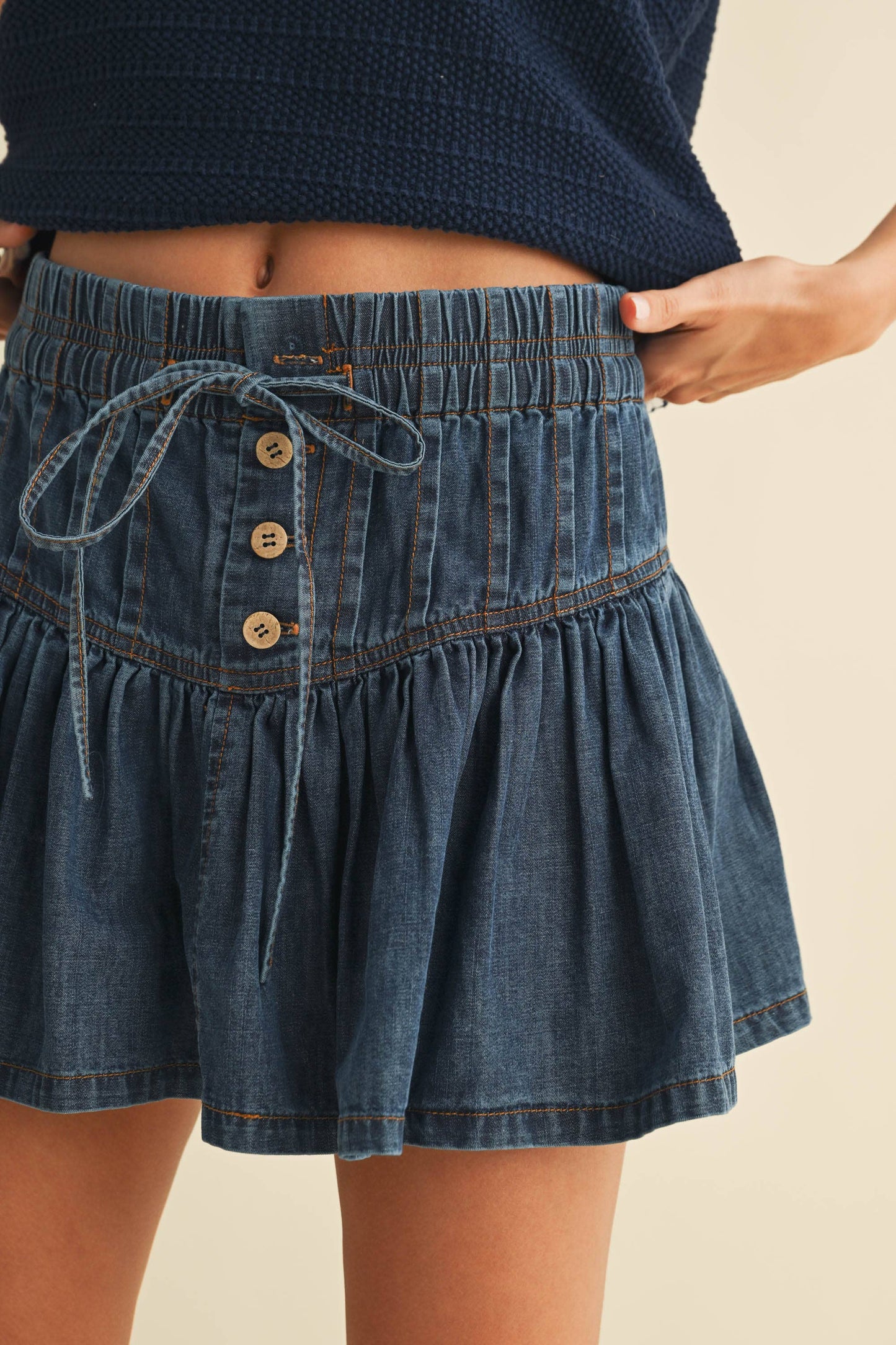 DENIM FLARED RUFFLE MINI SKIRT